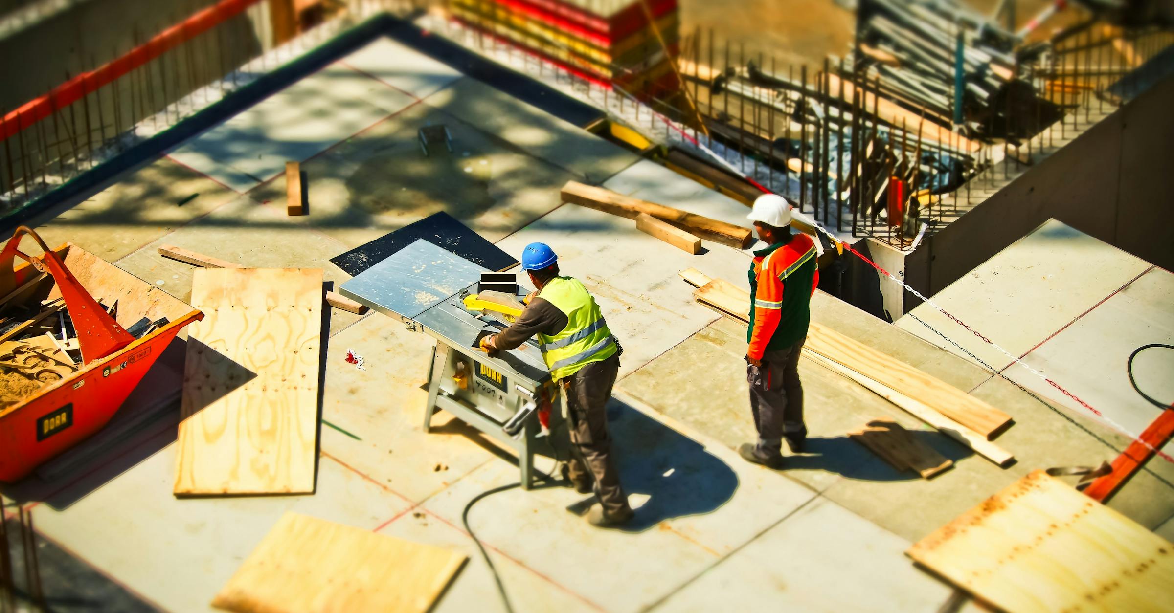Construction team reviewing architectural plans on site