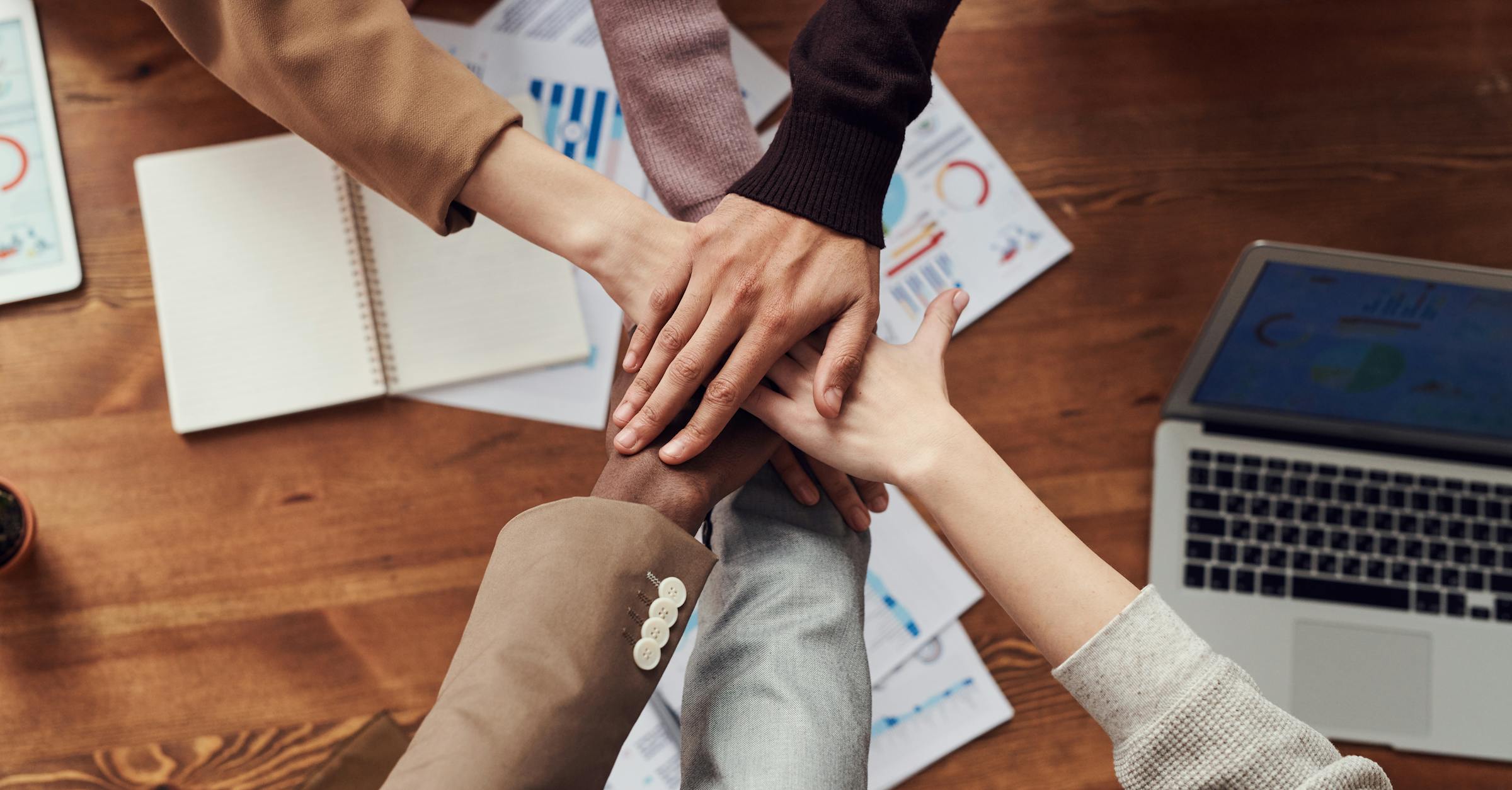 Team collaborating on individual software solutions in a modern office